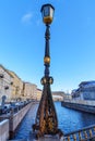 Old lamp on Great Konyushenny Bridge above Moika River. Saint Petersburg, Russia