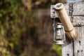 Old lamp hanging on the wooden holder Royalty Free Stock Photo