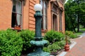 Old lamp post and brick walkway outside historic Canfield Casino,Saratoga,New York,2015 Royalty Free Stock Photo