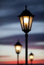 Old lamp post in sunset sky Royalty Free Stock Photo