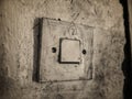 An old lamp switch mounted on the wall Royalty Free Stock Photo