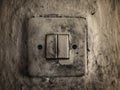 An old lamp switch mounted on the wall Royalty Free Stock Photo