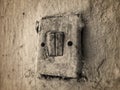 An old lamp switch mounted on the wall Royalty Free Stock Photo