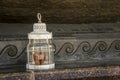 old lamp on a window sill, lantern, close-up Royalty Free Stock Photo
