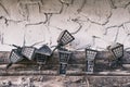 Old lamps hung on a concrete-wood wall