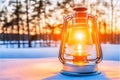 An old lantern casts a warm glow in the snow, illuminating the winter darkness around it, Generated AI Royalty Free Stock Photo