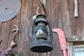 Old Lantern and Farm Tools On Cabin Wall