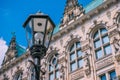 Old lantern in front od Hamburg City Hall Towers. Germany