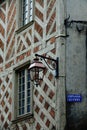 Old lantern and half-timbered house in a corner of Burgundy region of France