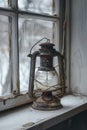 An old lantern sits on a window sill with a warm glow Royalty Free Stock Photo