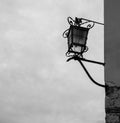 Old lantern on the wall with background on the sky