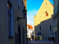 Spring Day in the City Street Sunshine Day old lantern on the wall of a medieval house