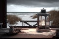 Old lantern on wooden table. Wooden cottage, holiday home, wintertime with snow. Rustic table with candle in glass lantern. View