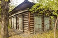 An old large abandoned log house with closed shutters Royalty Free Stock Photo