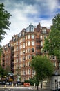 Old large apartment red brick houses in the area Kensington Olympia, London