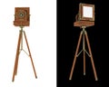 Old large format camera on tripod isolated