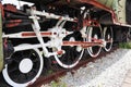 Old large iron train wheels, antique train or ancient railway, bogies are on the tracks for an industrial steam locomotive. Royalty Free Stock Photo