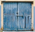 Old large wooden doors painted in blue Royalty Free Stock Photo