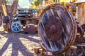 Old Large Wooden Wheel In Salvage Yard Royalty Free Stock Photo