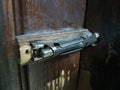 Old latch or heck on a wooden door