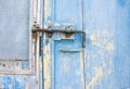 Old latch on a wooden blue door in Tuscany, Italy Royalty Free Stock Photo