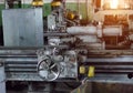 Old lathe at the enterprise, a sunset comes through the window, mechanism Royalty Free Stock Photo