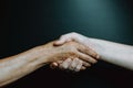 Old latina woman and young boy hand shaking hands Royalty Free Stock Photo