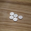 Old Latvian coins on a wooden background