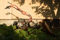 old lawnmower near the shed in the daytime Royalty Free Stock Photo