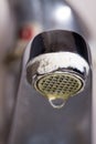 Old leaking faucet with stone and calcium sediments. Royalty Free Stock Photo