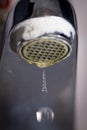 Old leaking faucet with stone and calcium sediments. Royalty Free Stock Photo