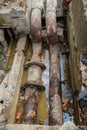 Old leaky pipes in the pit. Preparation for pipe replacement Royalty Free Stock Photo