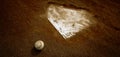 Old Leather Baseball on Field by Home Plate or Base Royalty Free Stock Photo