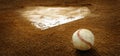 Old Leather Baseball on Field by Home Plate or Base Royalty Free Stock Photo