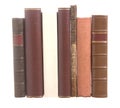 Old leather bound books with one white book Royalty Free Stock Photo