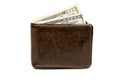 Old leather brown wallet with one and fifty hundred dollars banknotes isolated on white background Royalty Free Stock Photo