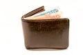 Old leather brown wallet with one and five thousand roubles banknotes isolated on white background Royalty Free Stock Photo