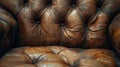 Vintage Brown Leather Chesterfield Sofa Detail with Buttoned Upholstery and Classic Design Royalty Free Stock Photo