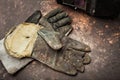 Old leather gloves for welders on rusty table Royalty Free Stock Photo