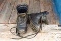 Old leather Hiking boots on the porch of a village house. Summer is a time of travel. Close up Royalty Free Stock Photo