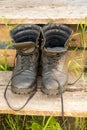 Old leather Hiking boots on the porch of a village house. Summer is a time of travel. Close up Royalty Free Stock Photo