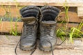 Old leather Hiking boots on the porch of a village house. Summer is a time of travel. Close up Royalty Free Stock Photo