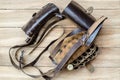 Old leather hunting bandoleer on a wooden table