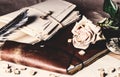 Old leather notebook and dry rose Royalty Free Stock Photo