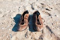 Old leather shoes on the beach Royalty Free Stock Photo