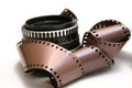 Old lens with film strip Royalty Free Stock Photo
