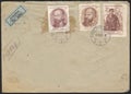 An old letter envelope and stamps. A worn letter envelope, stamps and stamp. Royalty Free Stock Photo