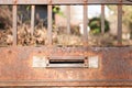 Old letterbox or mailbox in the gate door traditional way of delivering letters or mail to the house address close up Royalty Free Stock Photo