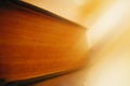 Old library book illuminated by sun ray background Royalty Free Stock Photo