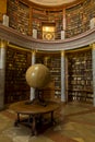 Old library with earth globe, and columns